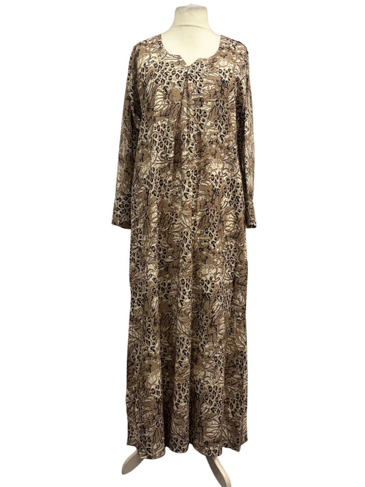 Long patterned dress on a mannequin against a white backdrop