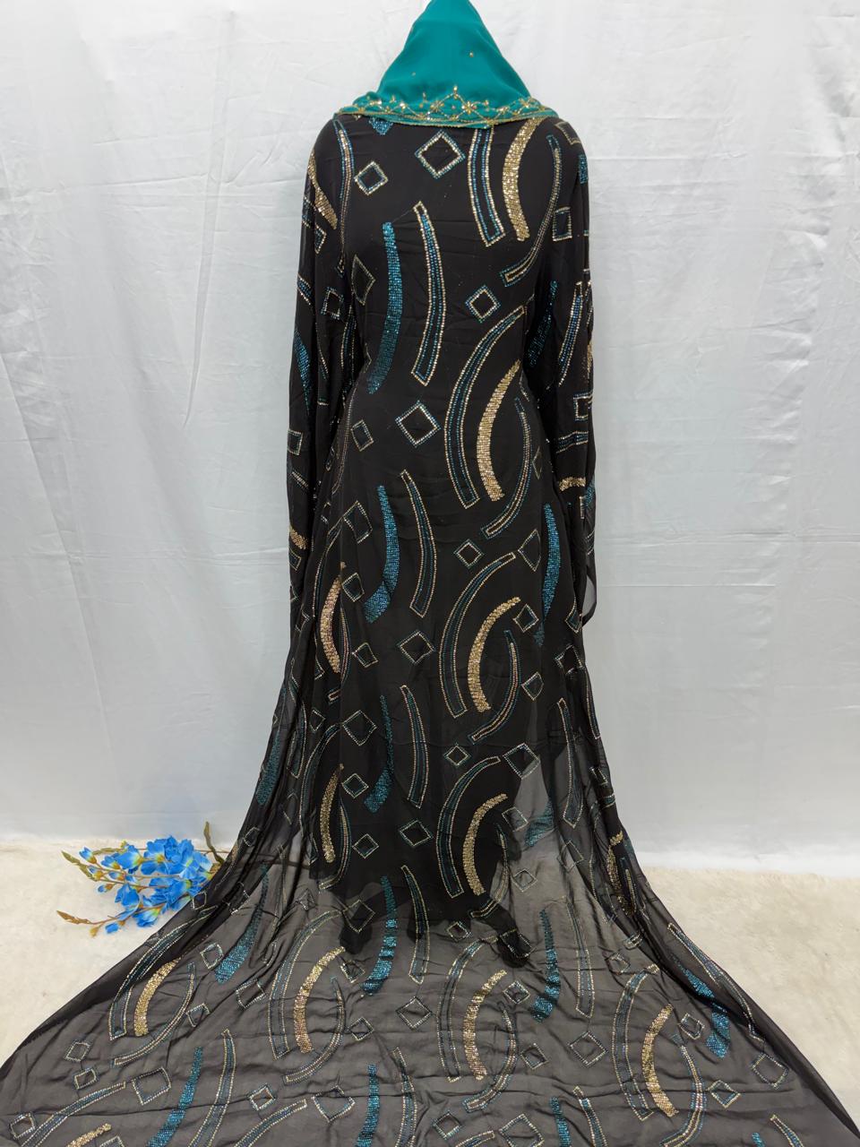 Black Somali Maysa garment with geometric patterns on a white background