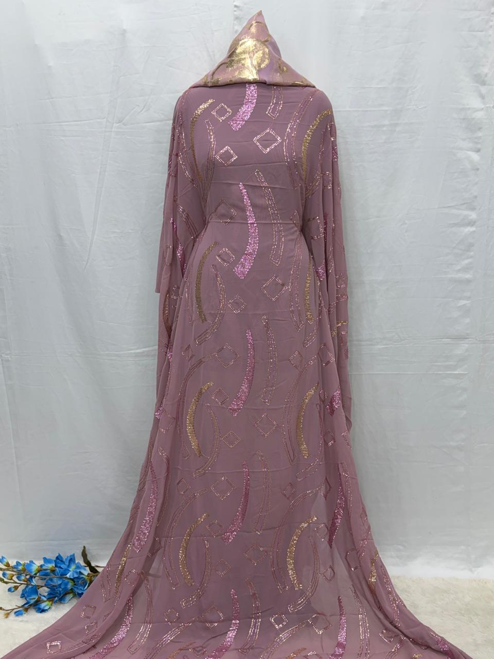 Mauve Maysa Dirac fabric with gold patterns on a white background