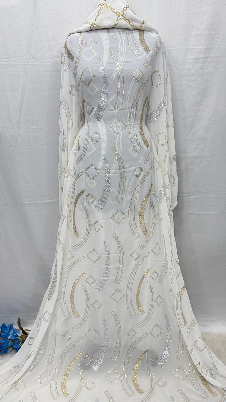 Elegant white Somali Maysa fabric with gold detailing on a mannequin against a gray background