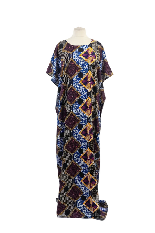 Colorful patterned Somali baati dress on a mannequin against a white background