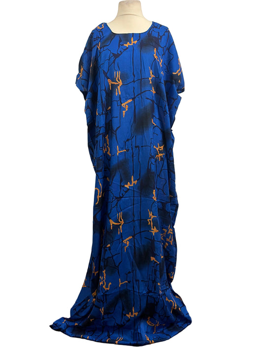 Blue dress with gold patterns on a mannequin against a white background