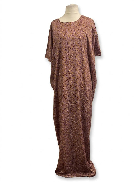 Brown patterned dress on a mannequin against a white background