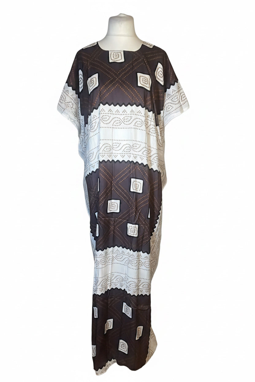 A short-sleeved kaftan dress displayed on a mannequin torso against a plain white background. The dress features a dark brown and white geometric pattern with woven lace-like details.