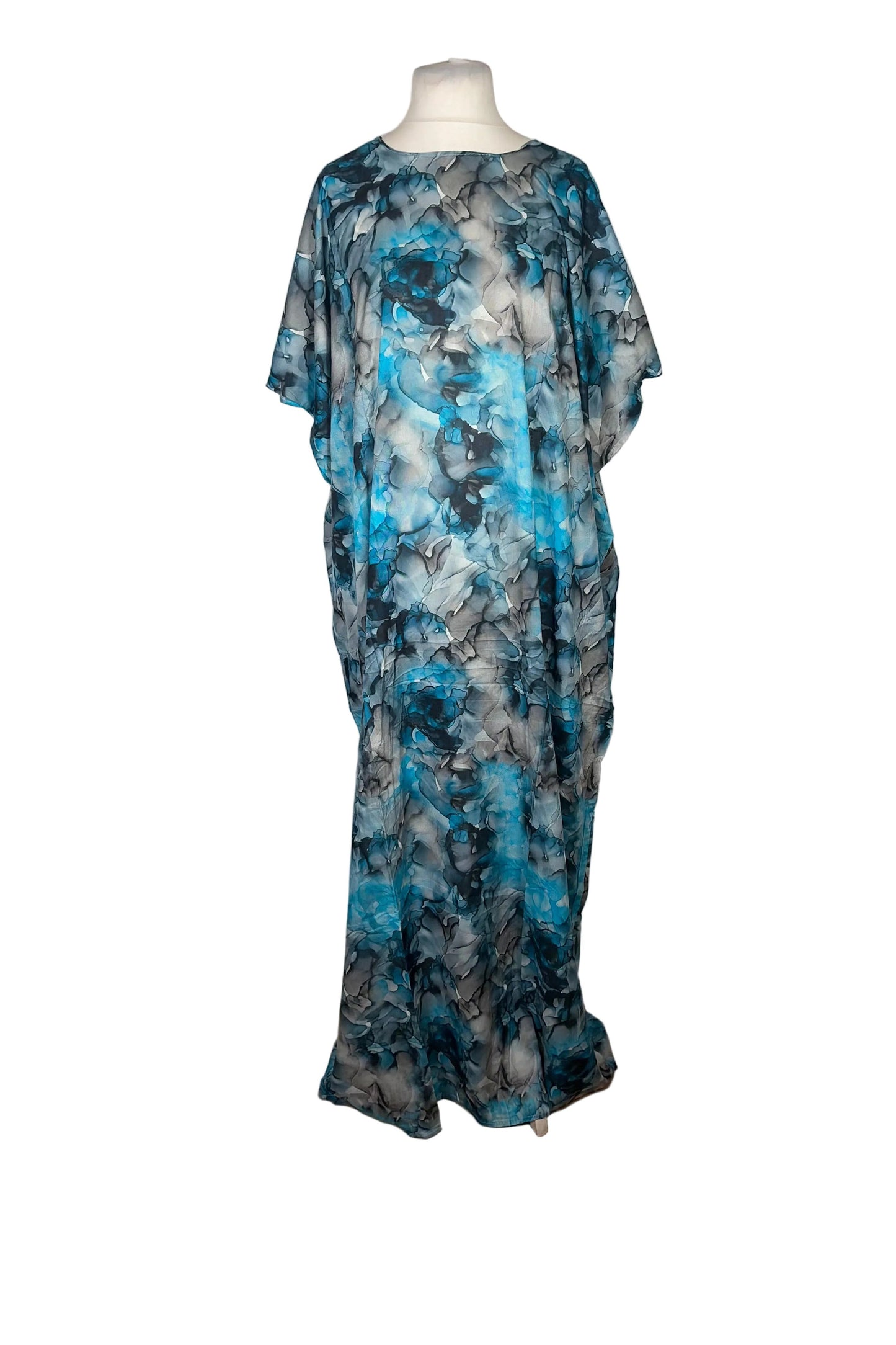 Blue and gray floral Somali Baati dress on a mannequin against a white background