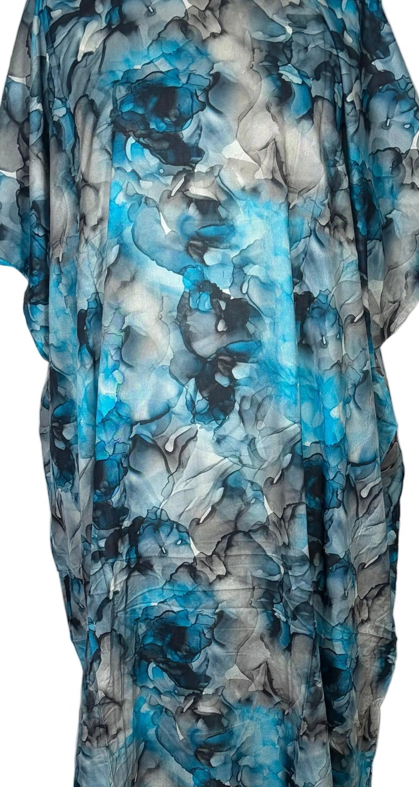 Blue floral Somali Baati dress on a mannequin against a white sheet on a wooden floor