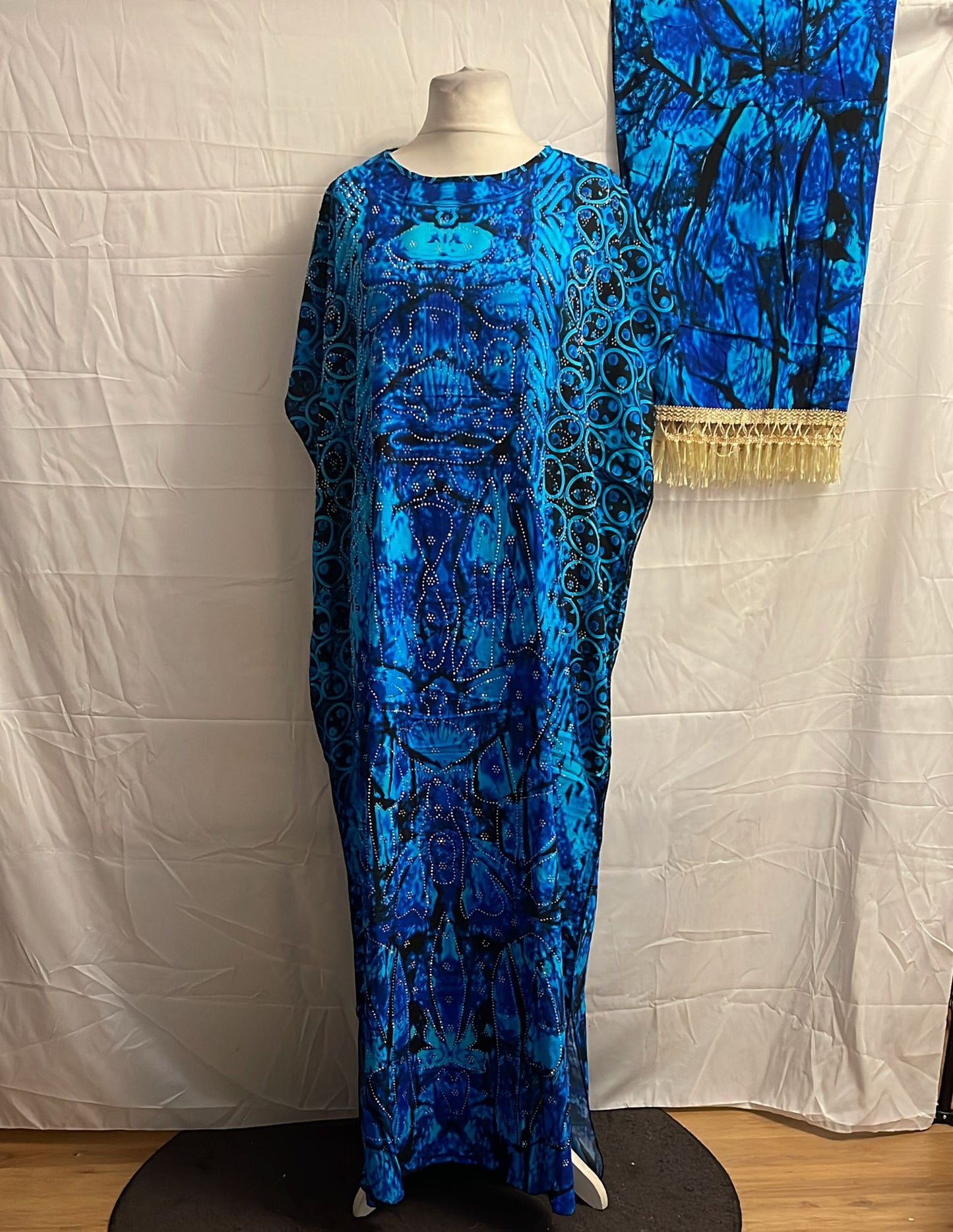 Blue patterned Somali Baati on a mannequin against a white background