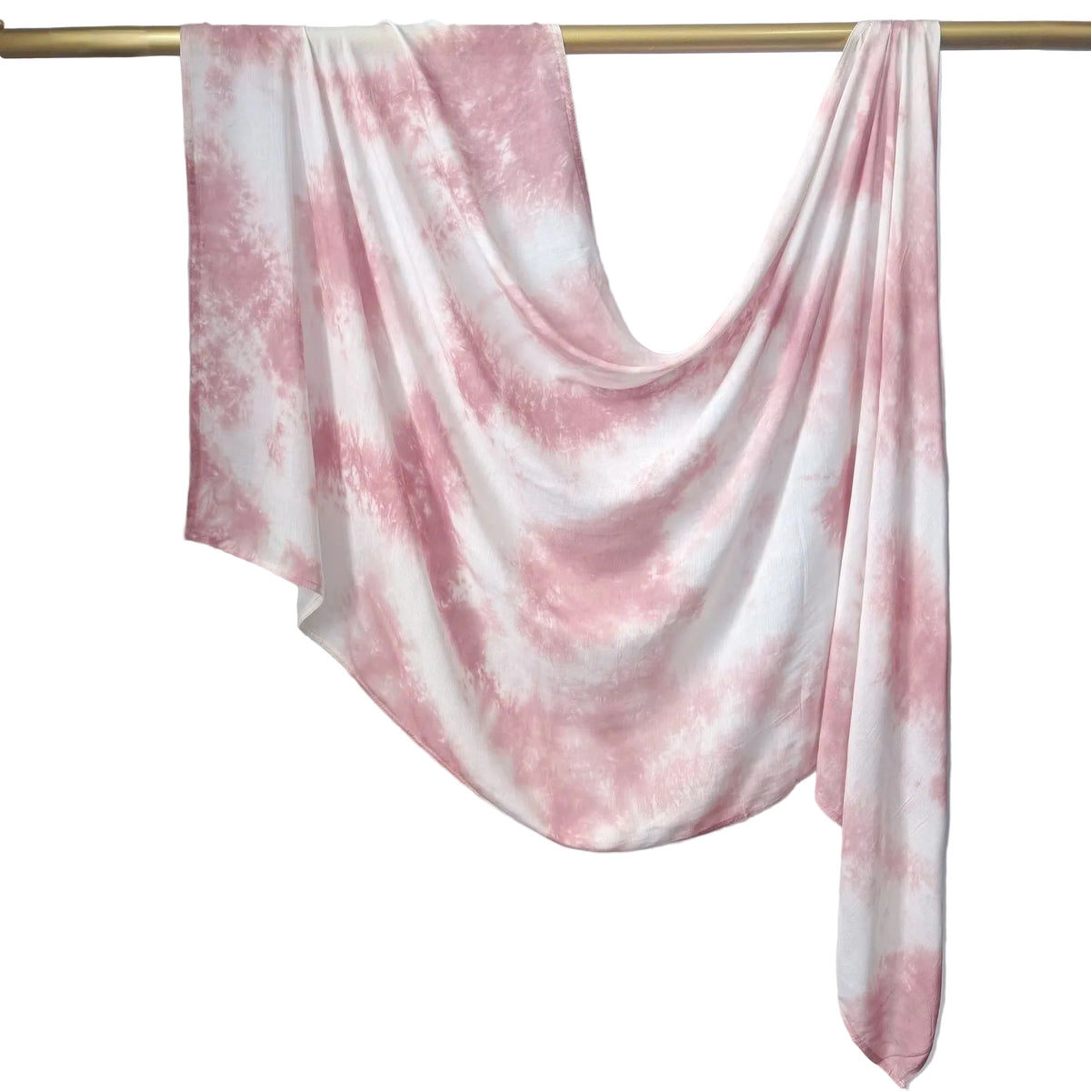 A lightweight fabric scarf or shawl with a pink and white tie-dye pattern, draped over a gold-colored clothing rack against a light gray paneled wall.