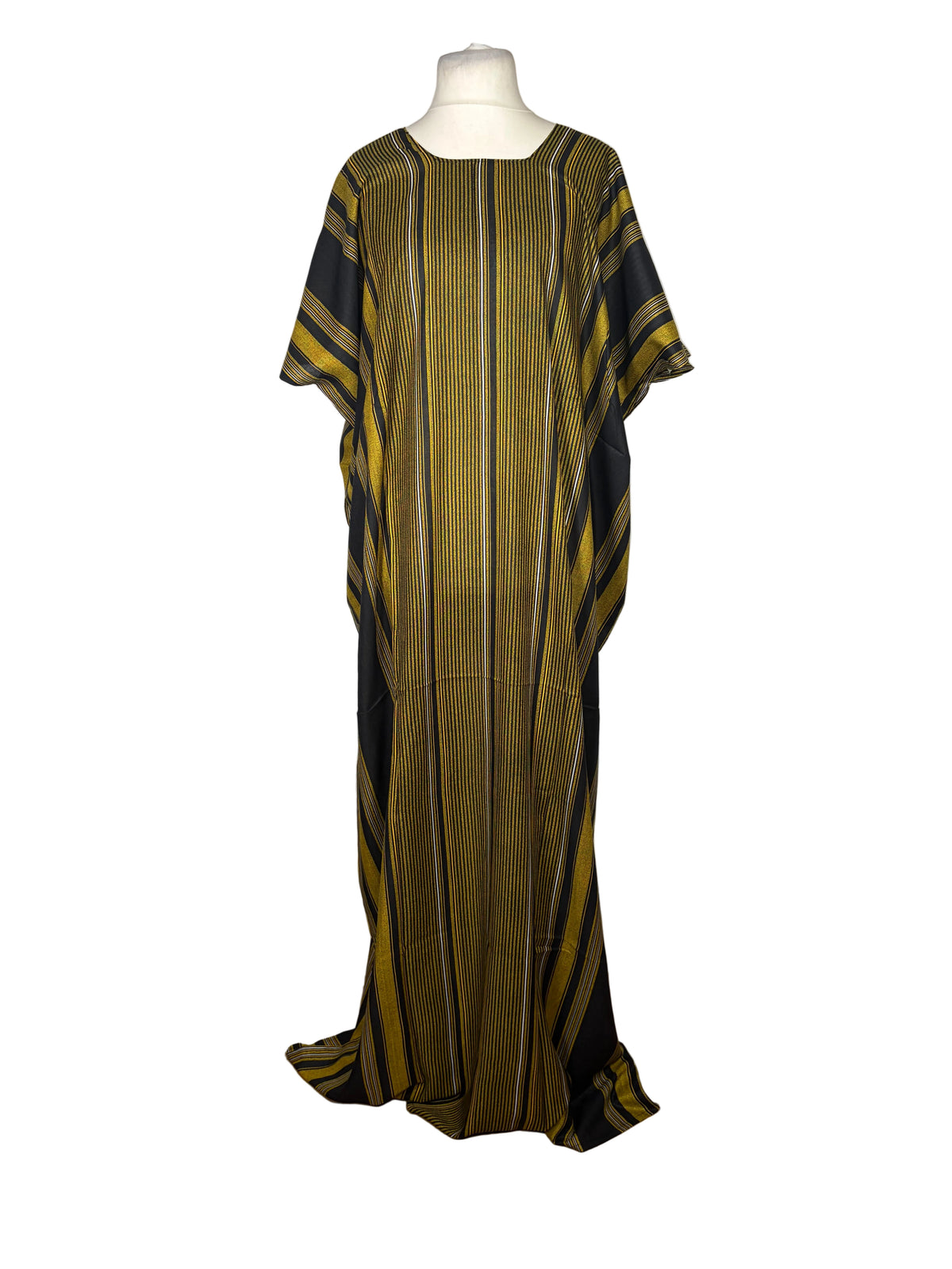 Green and black striped dress on a mannequin against a white backdrop