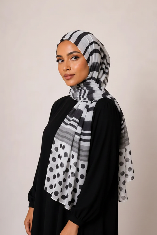 Model matching reference pose with stripe polka dot hijab